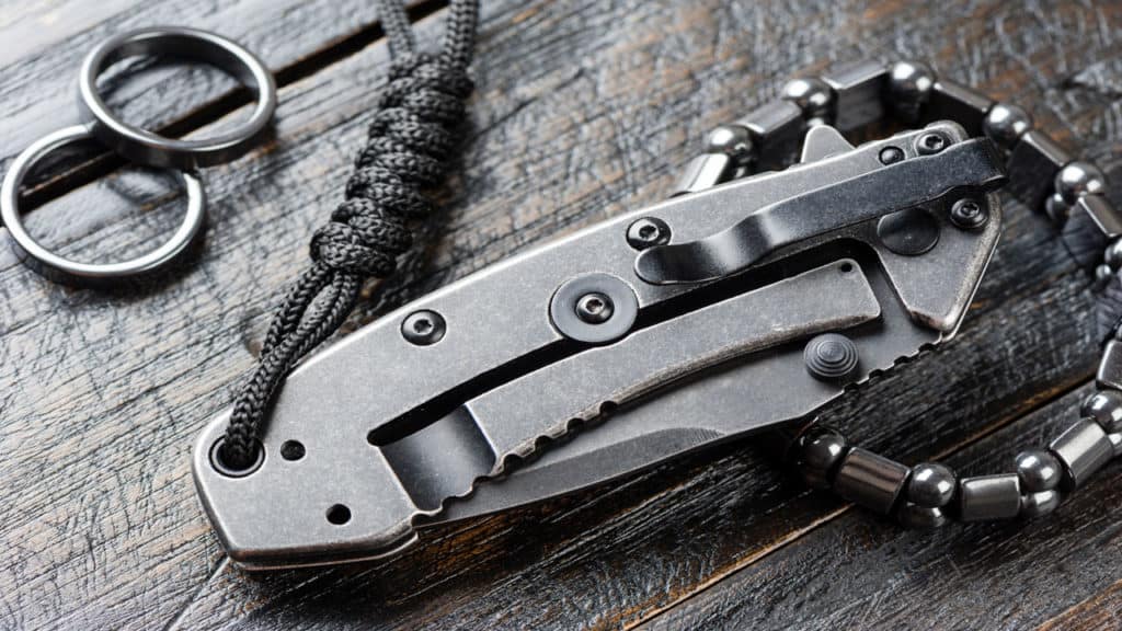 Folding tanto knife with a lanyard